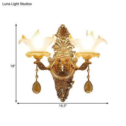 Vintage style gold wall light with opal glass lily shades and crystal pendants for bedroom lighting