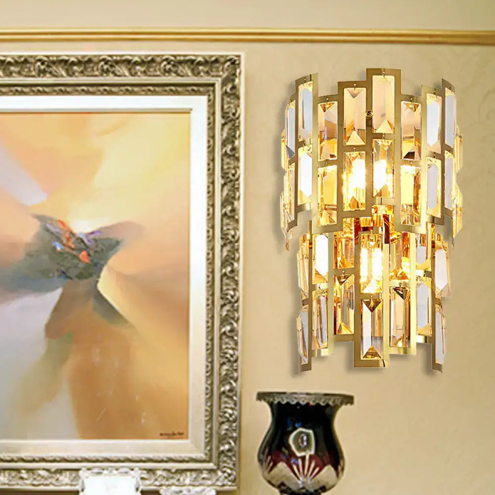 Vintage style gold tiered wall sconce with cascading rectangular crystal facets for living room lighting