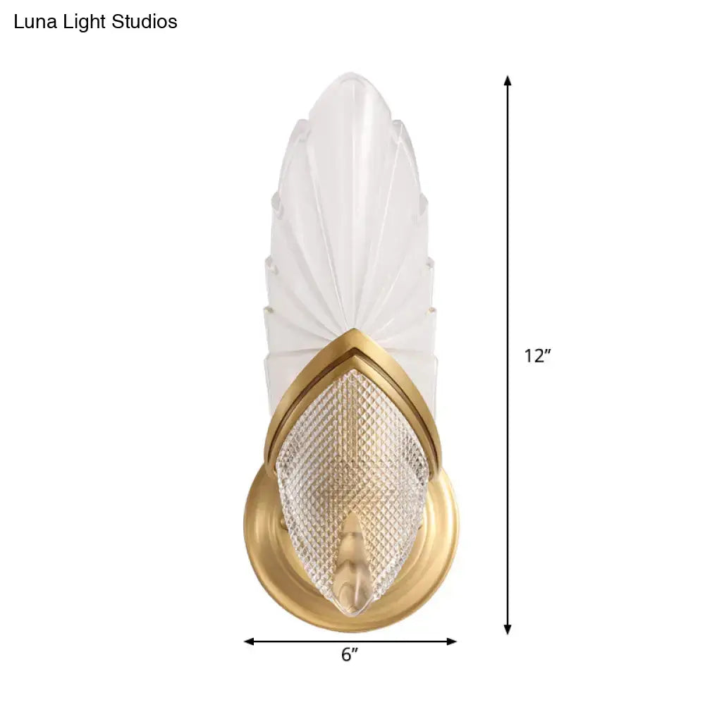 Vintage style gold wall lamp with frosted glass feather-shaped shade and metal frame for bedroom lighting