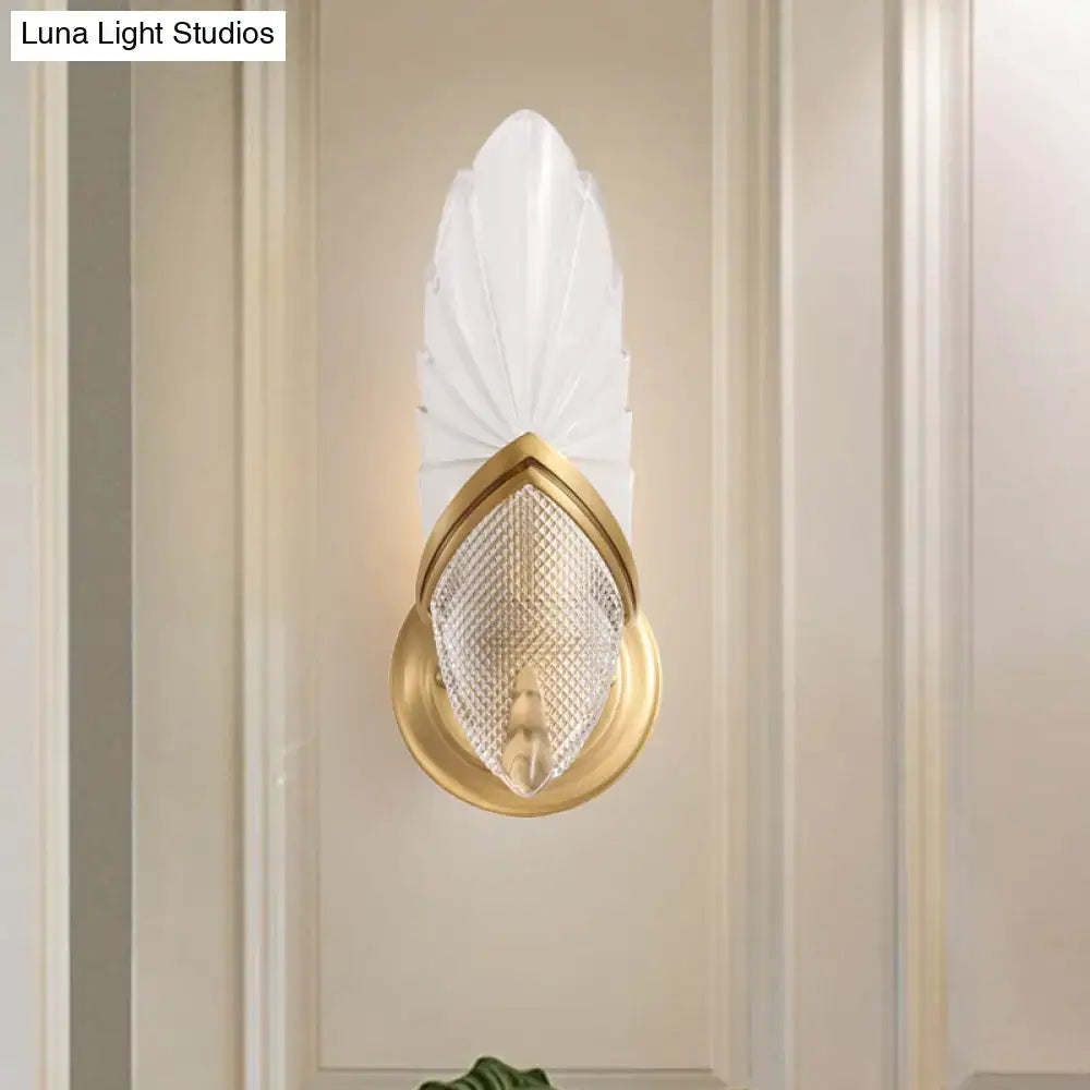 Elegant vintage style gold wall lamp with frosted glass feather shade and textured crystal panel for bedroom lighting