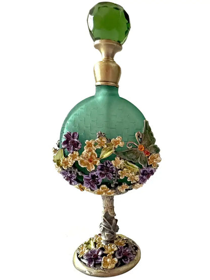 Vintage teal and purple glass perfume bottle with faceted stopper and floral butterfly embellishments for bedroom decor