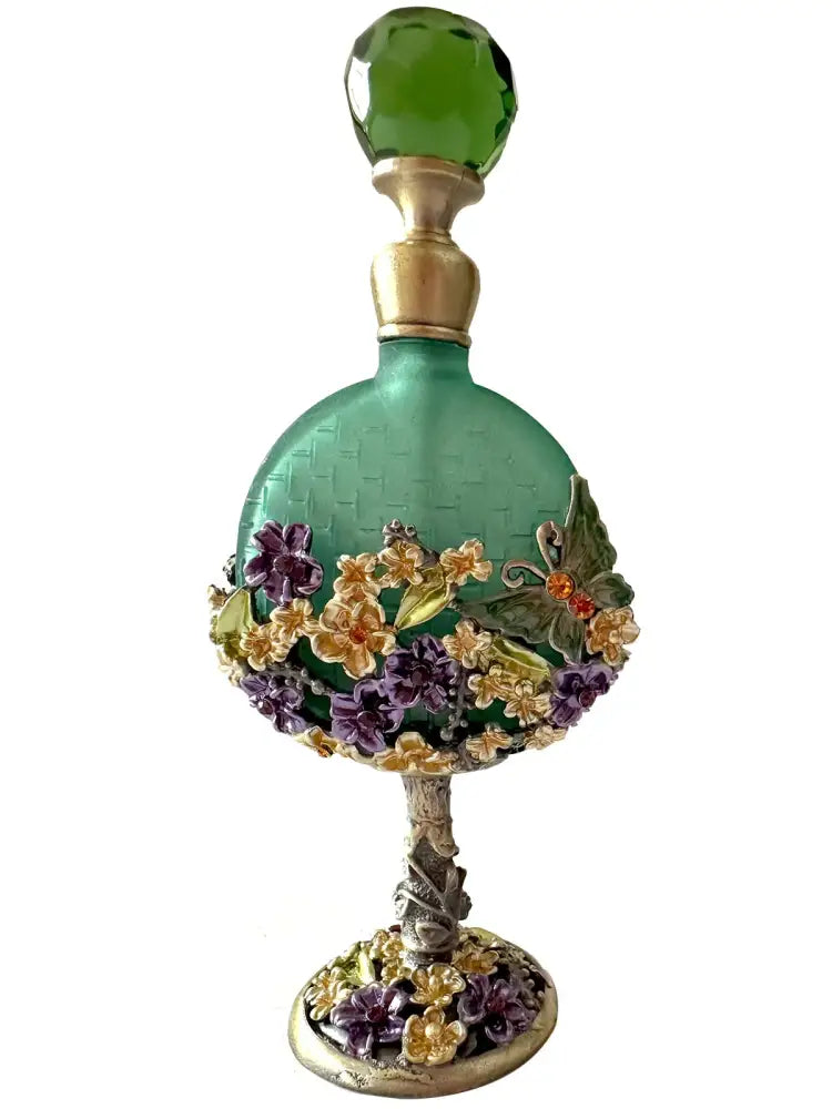 Vintage teal and purple glass perfume bottle with faceted stopper and floral butterfly embellishments for bedroom decor