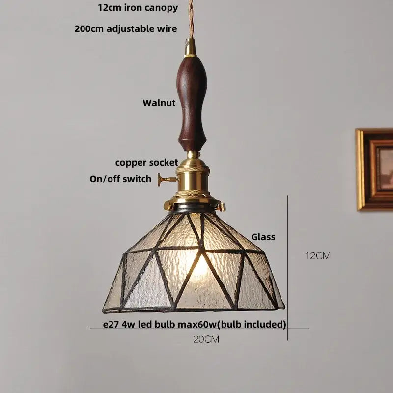 Vintage teal blue glass led pendant light with dark walnut handle brass accents and geometric decorbites blue glass shade