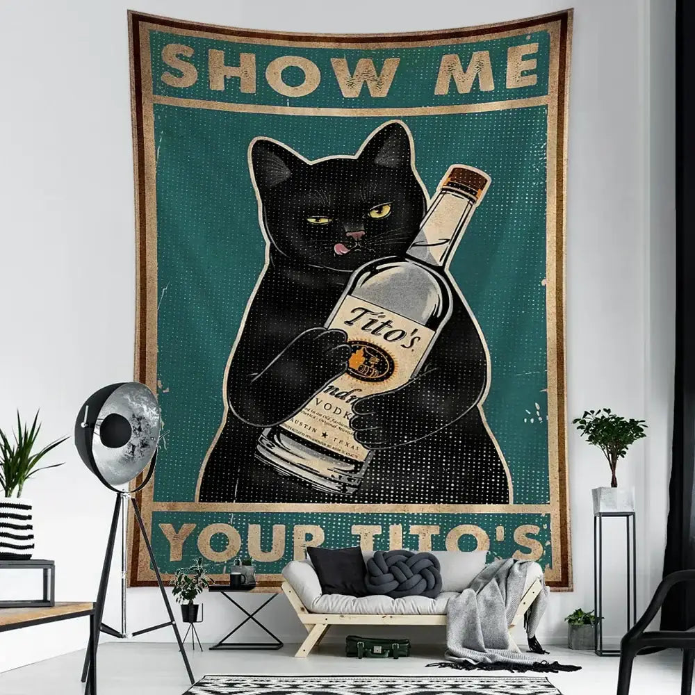 Black cat holding a bottle of tito’s vodka on a vintage teal and gold cat tarot tapestry for decorbites cat tarot decor