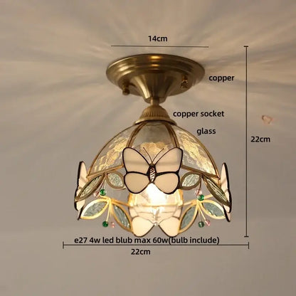Vintage tiffany stained glass led ceiling lamp with a copper finish and butterfly leaf design accented by green gemstones