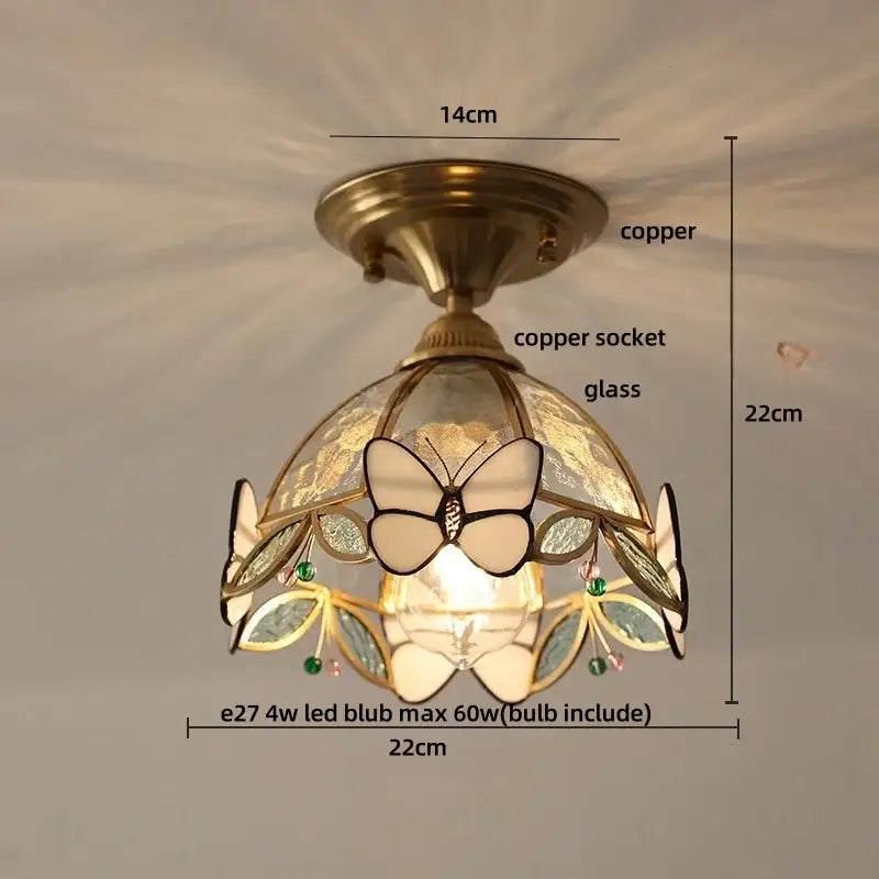Vintage tiffany stained glass led ceiling lamp with a copper finish and butterfly leaf design accented by green gemstones