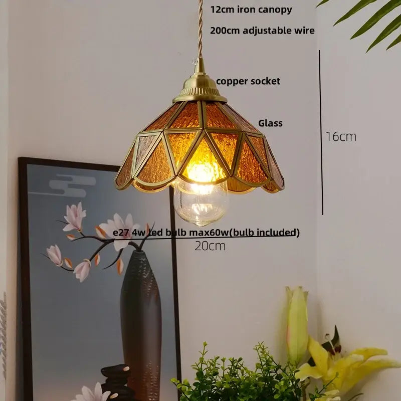 Vintage tiffany stained glass pendant lamp with warm amber geometric panels and decorbites brass vintage fixture