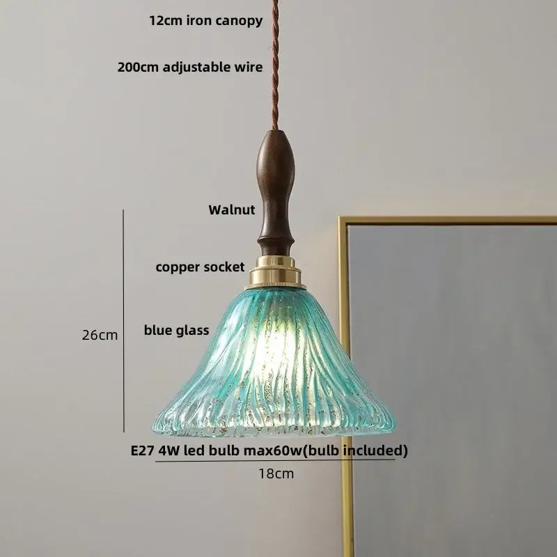A 26cm pendant light with a textured blue glass shade, walnut-finished iron canopy, and copper socket for dining room decorbites led wood walnut