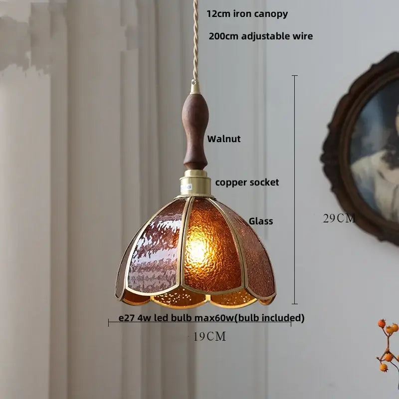 A warm amber glass pendant light with walnut finish wooden handle and brass accents for dining room decorbites led wood walnut