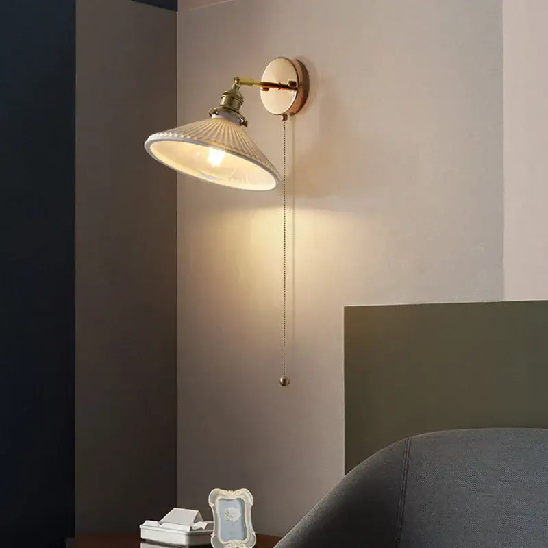 Antique brass wall sconce with white ribbed glass shade and adjustable pull-chain switch for decorbites copper canopy led lighting