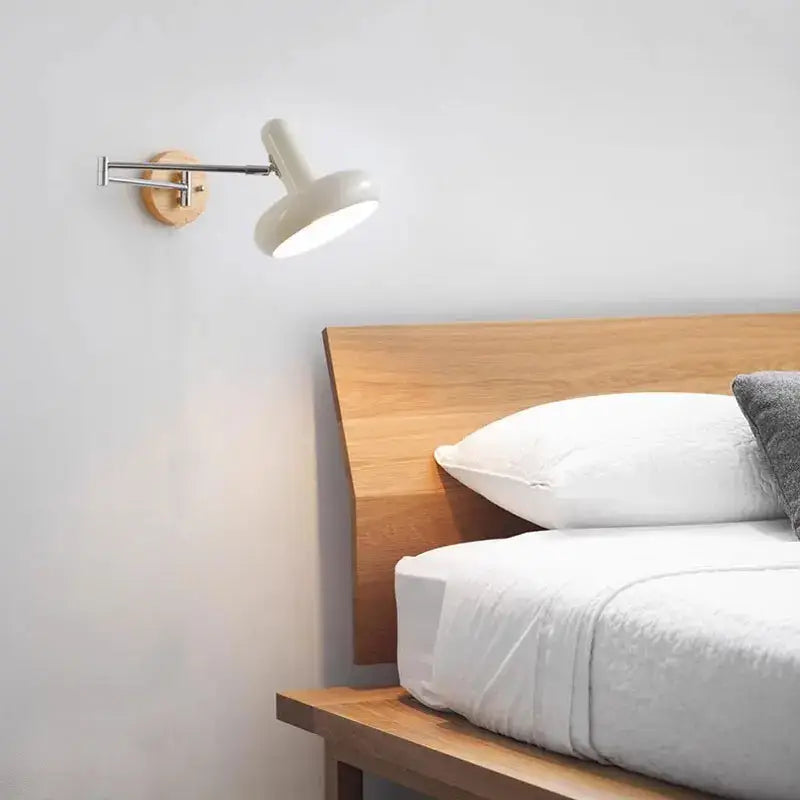 A sleek vintage white ceramic and wood cream wind rocker wall lamp with articulated arm for bedroom decorbites wall lamp