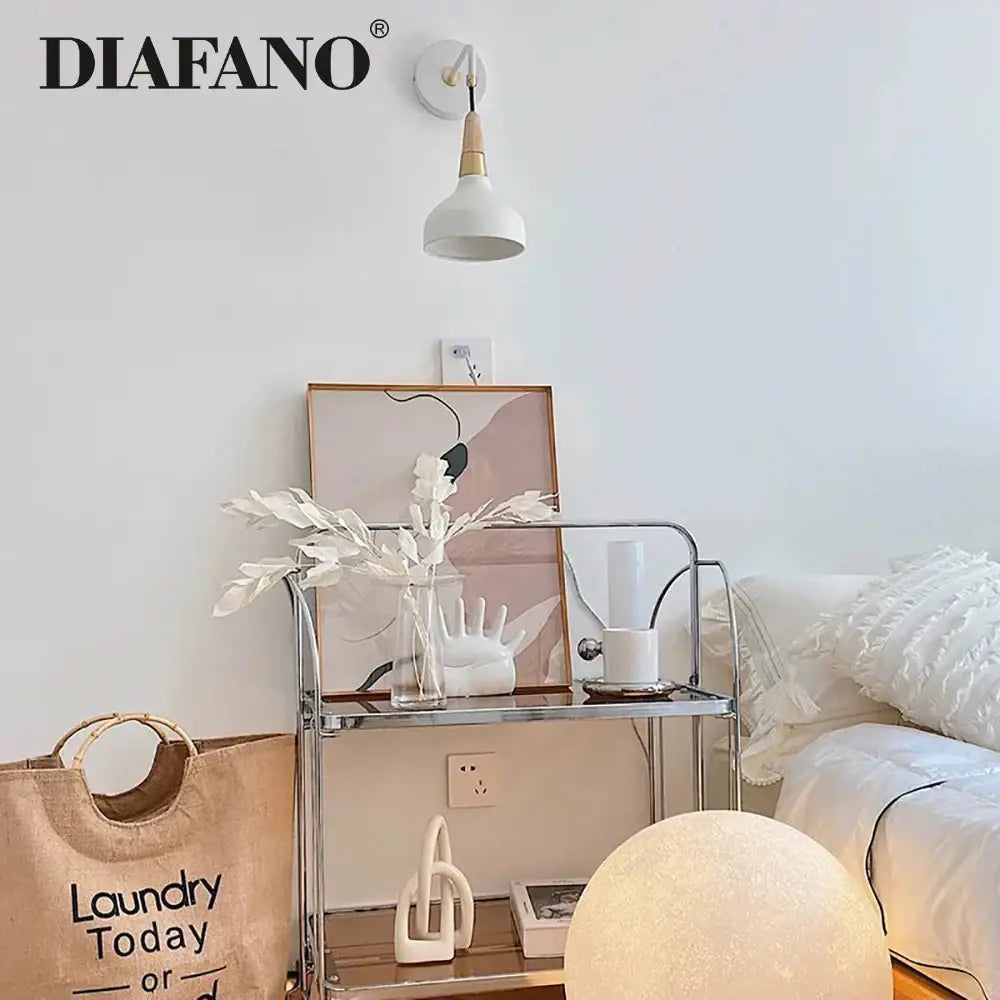 White vintage wall lamp with ceramic body wooden accent and conical shade for bedroom lighting mounted on wall