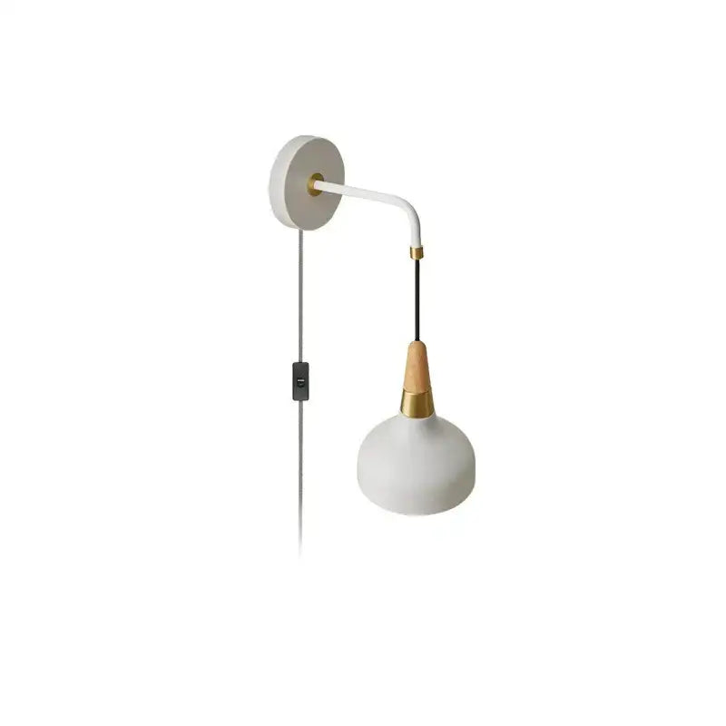 Minimalist vintage wall lamp with matte white ceramic shade, brass accents, and light wood neck for bedroom use