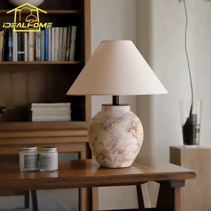 Vintage white and gray decorbites ceramic led table lamp with a rustic textured base and soft off-white fabric shade