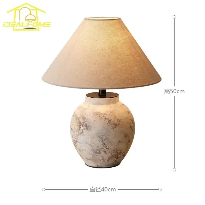 A rustic beige vintage white and gray decorbites ceramic led table lamp with textured ceramic led table finish and tapered shade