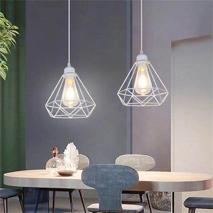 Two white metal dome shade loft pendant lights with geometric wire cages and exposed bulbs for dining room decorbites pendant light