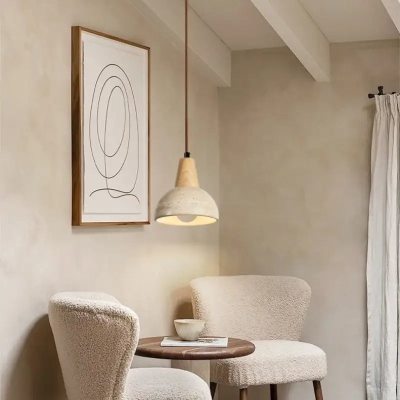 Vintage wood and concrete led pendant light with frosted glass shade and copper cord hanging above a bed
