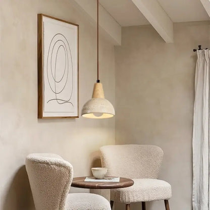 Vintage wood and concrete led pendant light with frosted glass shade and copper cord hanging above a bed