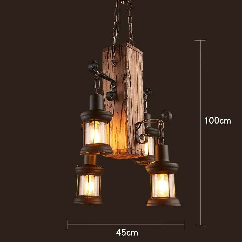 Rustic vintage wood ceiling chandelier with three black metal lanterns hanging from wrought iron arms for dining room