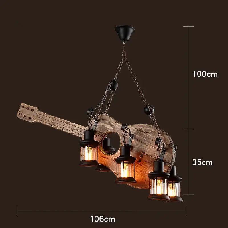 Rustic vintage wood ceiling chandelier shaped like a guitar with four black lanterns hanging from chains