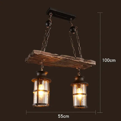 Rustic vintage wood ceiling chandelier with wooden beam, two lantern-style bulbs, and black metal chains for dining room