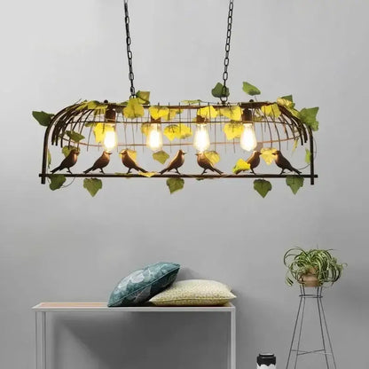 Vintage wrought iron bird cage chandelier with golden-brown birds green leaves and exposed bulb lighting for decorbites bird cage