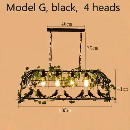 Black metal bird cage chandelier with four bulbs, green vine accents, and bird silhouettes for vintage garden decorbites decor