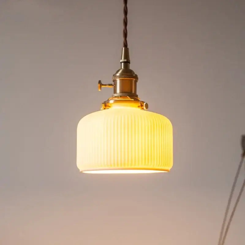 Warm yellow ribbed glass led pendant light with brass hardware and twisted cord for kitchen dining room pendant lights