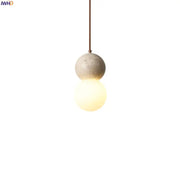 Vintage yellow travertine glass ball led pendant lamps featuring a concrete sphere pendant light with warm glass ball decorbites