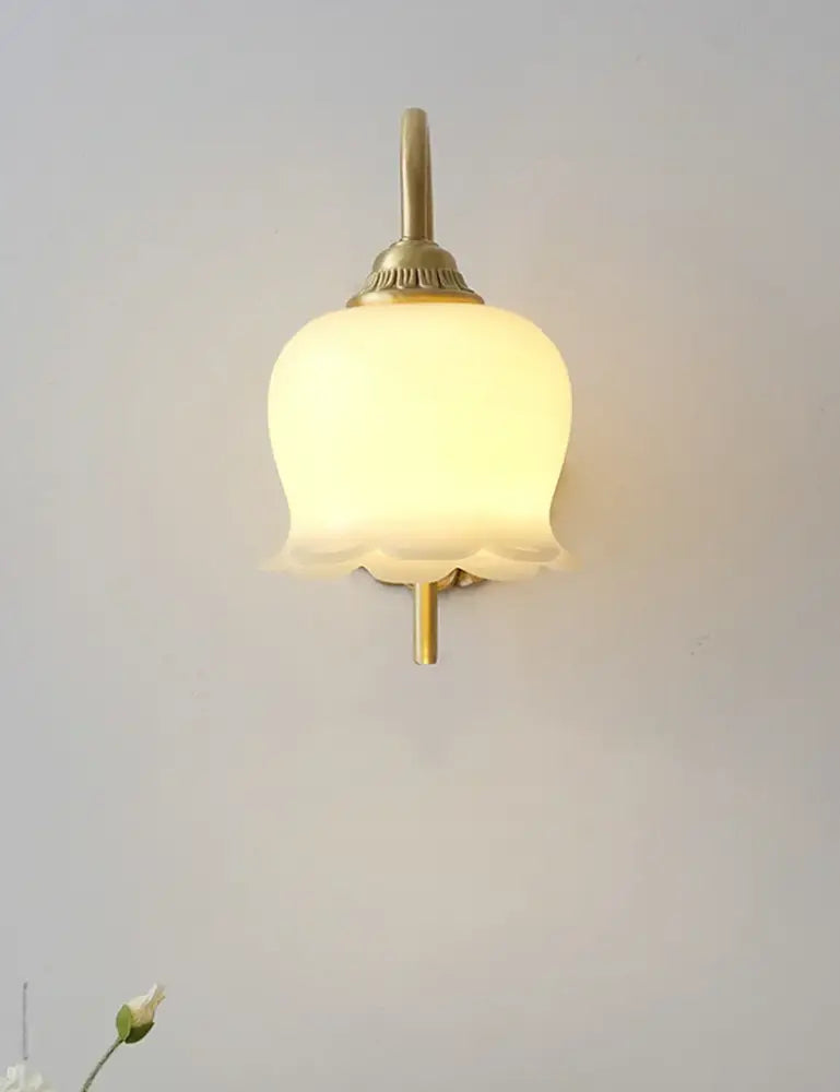 A warm yellow tulip pendant light with frosted glass petals and decorbites brass resin led finish for dining room decor