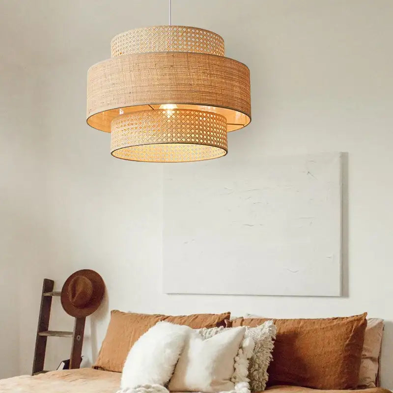 Beige woven rattan wabi sabi pendant light with tiered cylindrical bamboo shade for dining room layered design