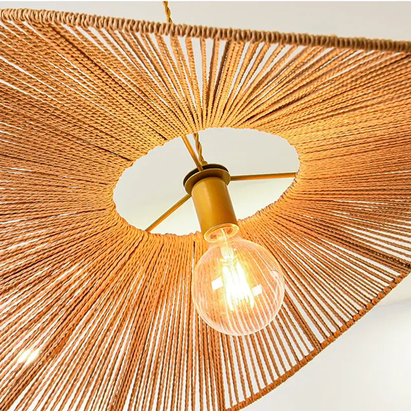 Warm-toned bamboo wabi sabi pendant lights with rope design and brass bulb holder for dining room use