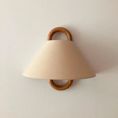 Wabi-sabi beech wood wall lamp with beige fabric shade and natural wood rings for bedroom lighting