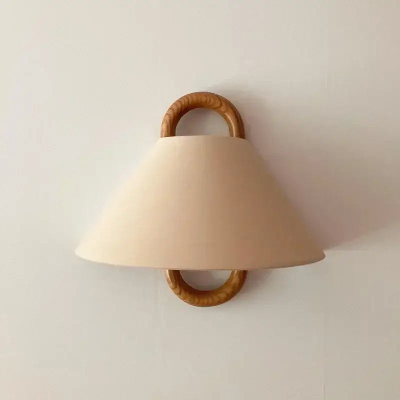 Wabi-sabi beech wood wall lamp with beige fabric shade and natural wood rings for bedroom lighting