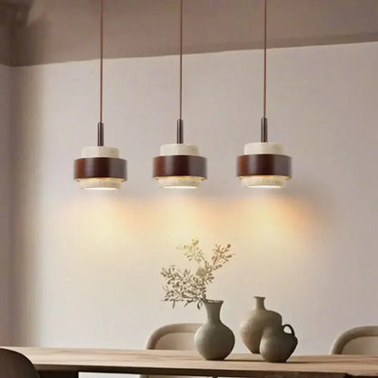 Wabi sabi beige and brown pendant light fixture with wooden rings and white marble discs for living room lighting