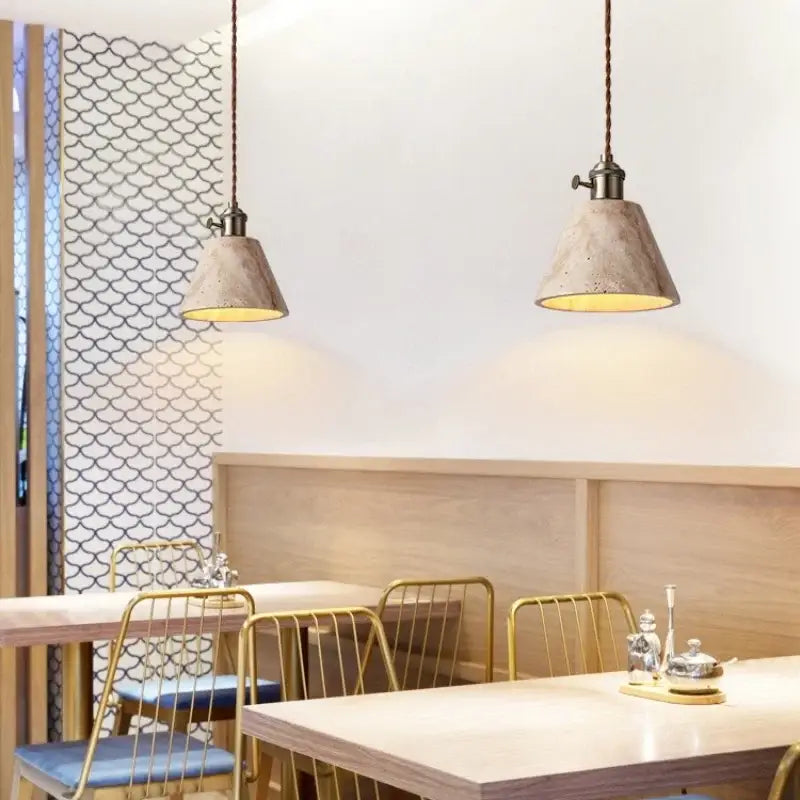Wabi sabi beige concrete pendant lights with led yellow travertine warm glow and dark brown braided cords for dining room decorbites led yellow