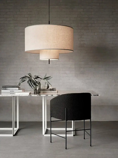 Beige linen cylindrical pendant lamps with layered fabric shades and black rod for dining room decor bohemia wabi sabi