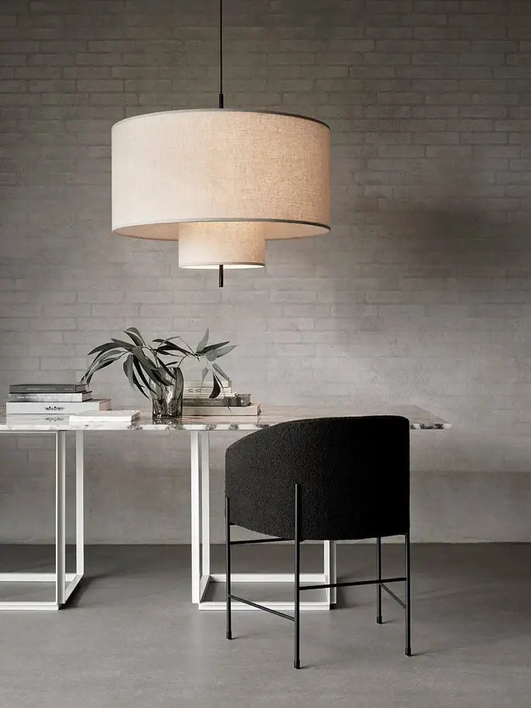 Beige linen cylindrical pendant lamps with layered fabric shades and black rod for dining room decor bohemia wabi sabi