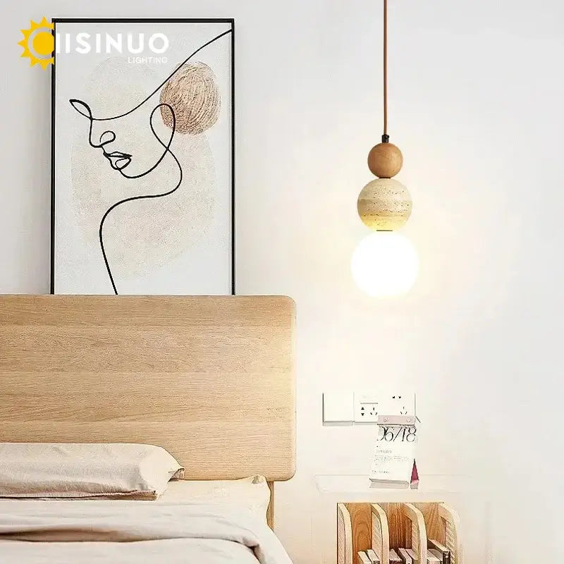 Wabi sabi beige stone and wooden accent pendant light with two stacked wooden orbs and glowing bulb on thin cord pendant