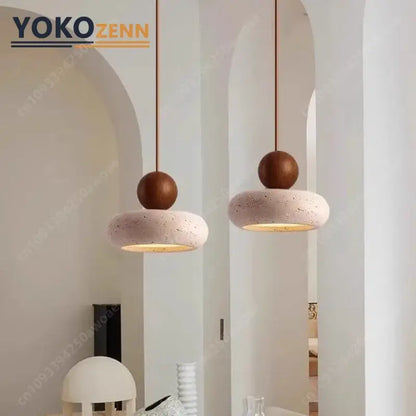 Two yokozenn pendant lights with matte white travertine stone discs 15cm x 11cm and dark brown wooden spheres