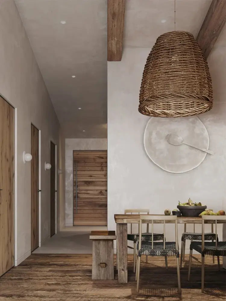 Wabi sabi brown handmade rattan pendant lamp with conical textured shape hanging above dining table decorbites handmade rattan seaside