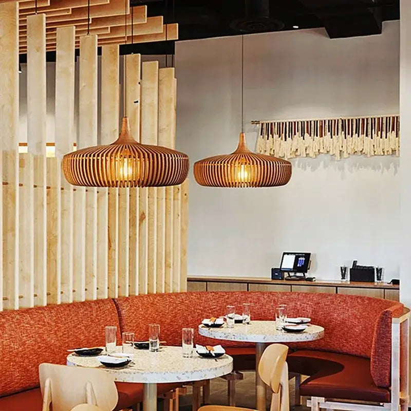 Warm-toned wabi-sabi brown ribbed wood pendant light serves as an elegant square meters light source above dining tables