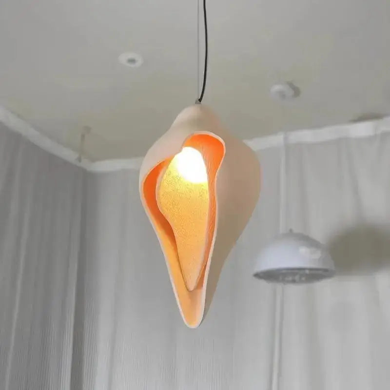 Wabi sabi cream gypsum conch pendant lamp with warm-toned shell shape and smooth matte finish for living room decorbites gypsum conch