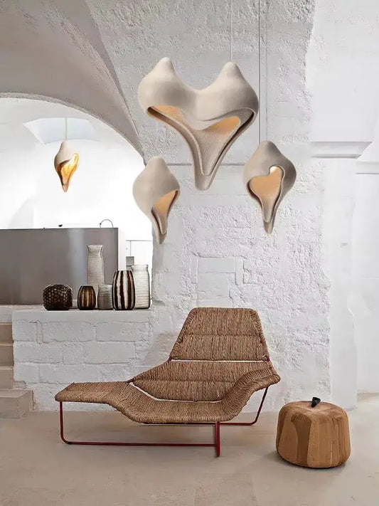 Wabi sabi cream gypsum pendant lamp with sculptural shell design and warm interior lighting for living room decor