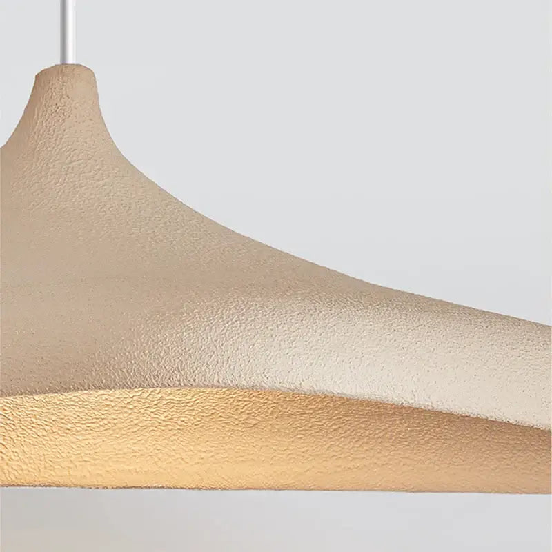 Beige and gold textured wabi sabi cream pendant light made of high polymer with a matte sculpted finish for dining rooms