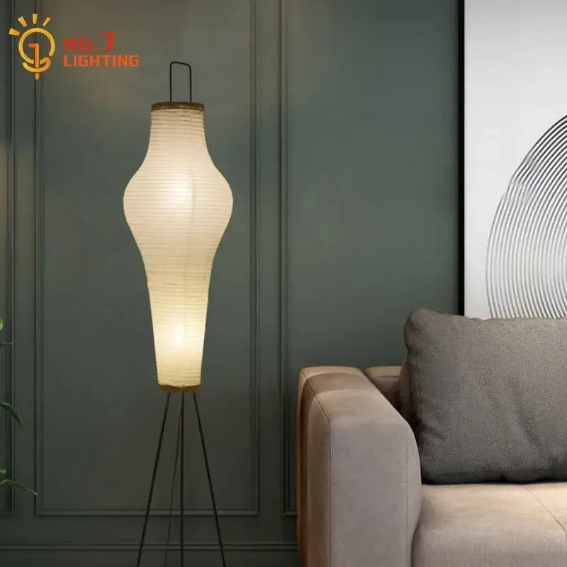 Wabi-sabi cream paper tripod floor lamp with a slender tripod base ideal for living room art decor and lighting