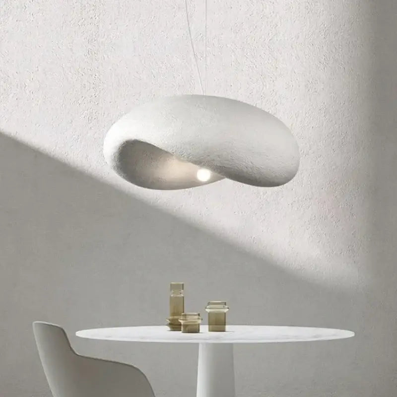 A sleek off-white wabi sabi cream style led chandelier with a smooth organic form and soft diffused glow for living room decorbites cream style