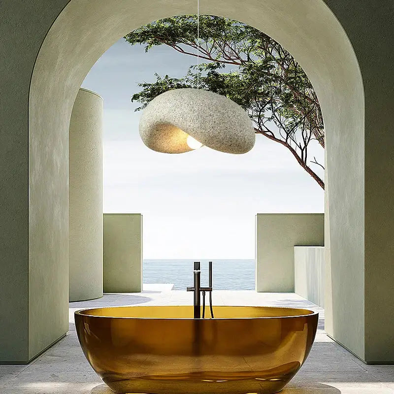A sleek amber-gold freestanding bathtub paired with wabi sabi cream style led chandelier for elegant decorbites cream style decor