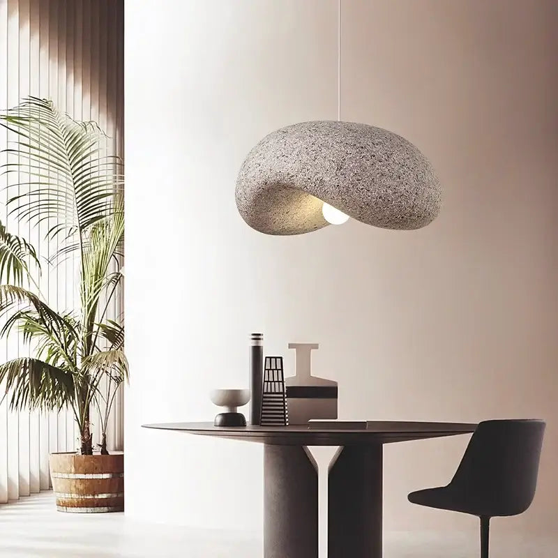 Gray textured stone pendant light with smooth organic shape and soft glow for wabi sabi decorbites cream style led chandelier