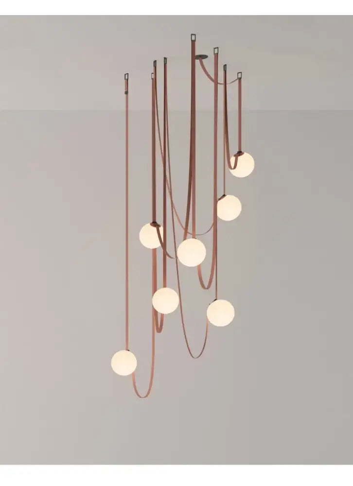 A wabi sabi designer copper and white chandelier with nine frosted glass bulbs for living room duplex wabi sabi decor